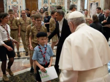 Pope Francis meets with members of the Scouts Unitaires de France at the Vatican, May 14, 2021.